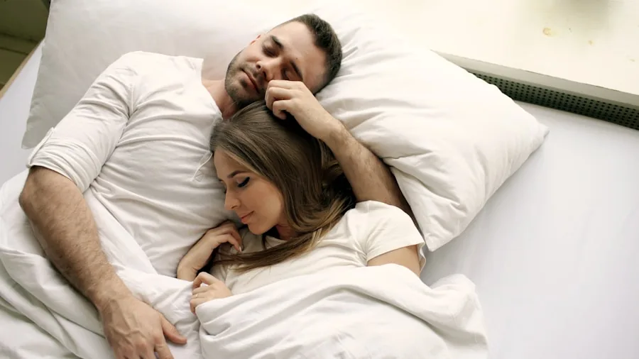 The 13 Best Mattresses 5 A couple sleeping peacefully together in bed with natural morning light streaming through the window