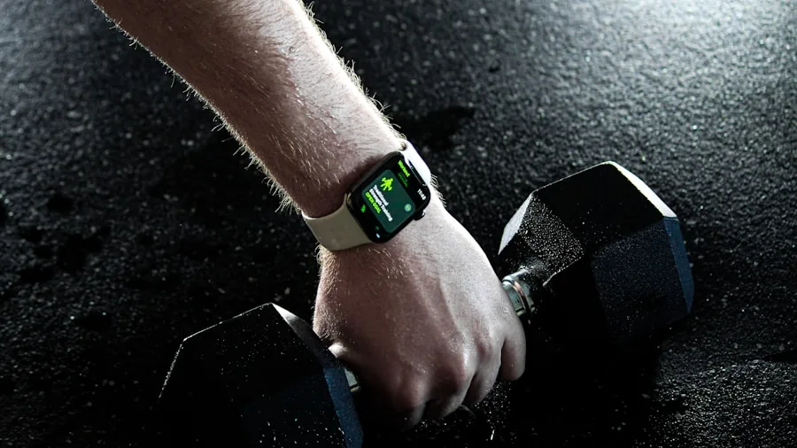 Active person monitoring workout metrics on wrist device during indoor exercise session