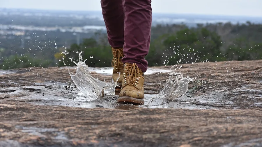 The %product_count% Best Samsung Phones 5 Active person splashing through water during outdoor hiking adventure in natural landscape