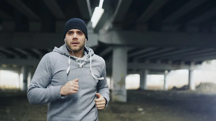 Active runner jogging outdoors while wearing headphones, focusing on audio and music experience during exercise