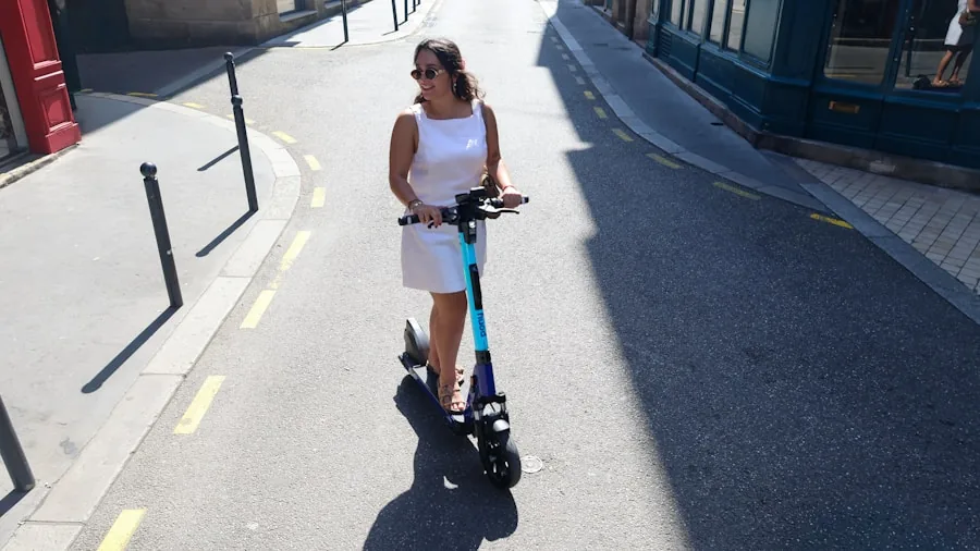 Adult commuter riding electric scooter on city street during daytime