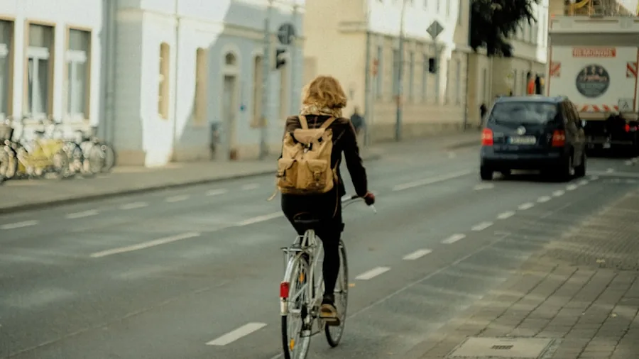 Adult on electric scooter demonstrating safe braking technique on city street