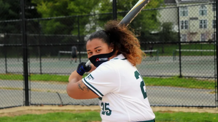 The %product_count% Best Softball Bats 4 Athlete measuring proper softball bat length by standing it upright next to body for correct sizing