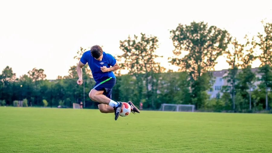 Athletic football player demonstrating speed and agility drills on grass field during practice