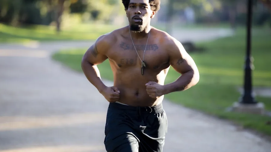 Athletic man jogging outdoors on a sunny day, demonstrating breathable workout clothing during warm weather exercise