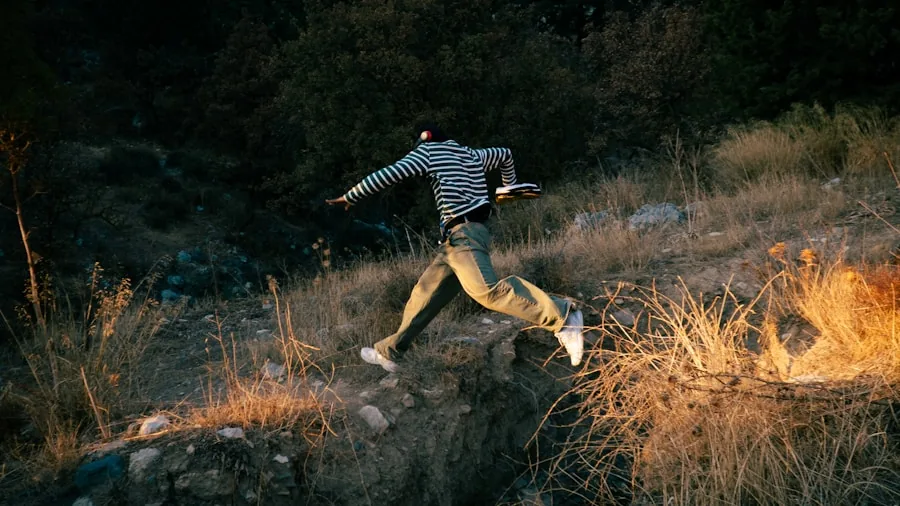 Athletic man sprinting with dynamic movement, demonstrating active lifestyle and athletic performance outdoors