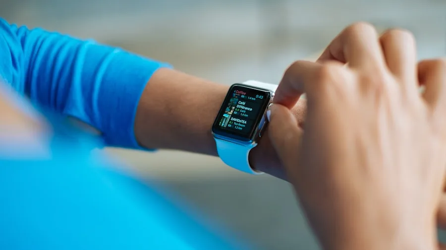 Athletic person checking device battery during outdoor run workout