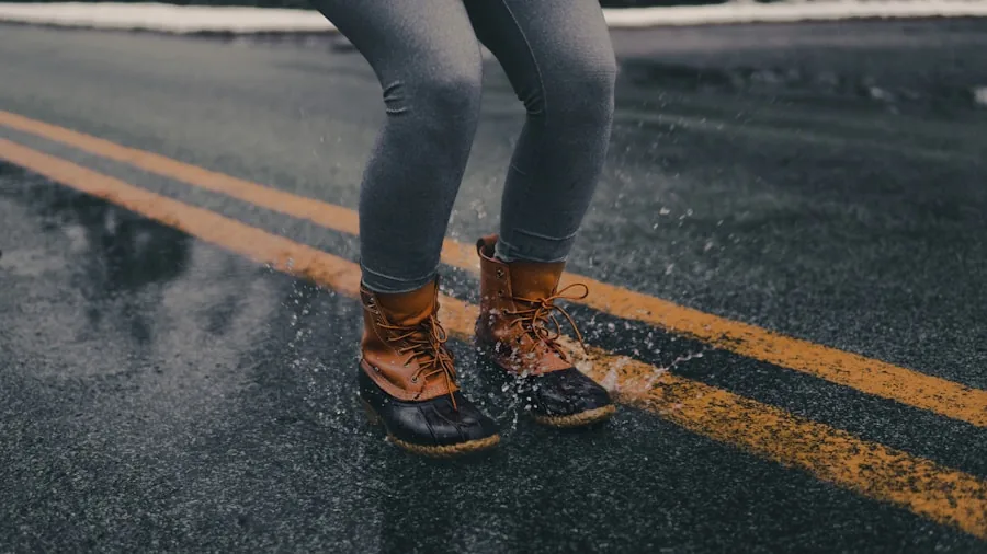 Athletic person jogging in rainy weather with sweat and moisture on skin