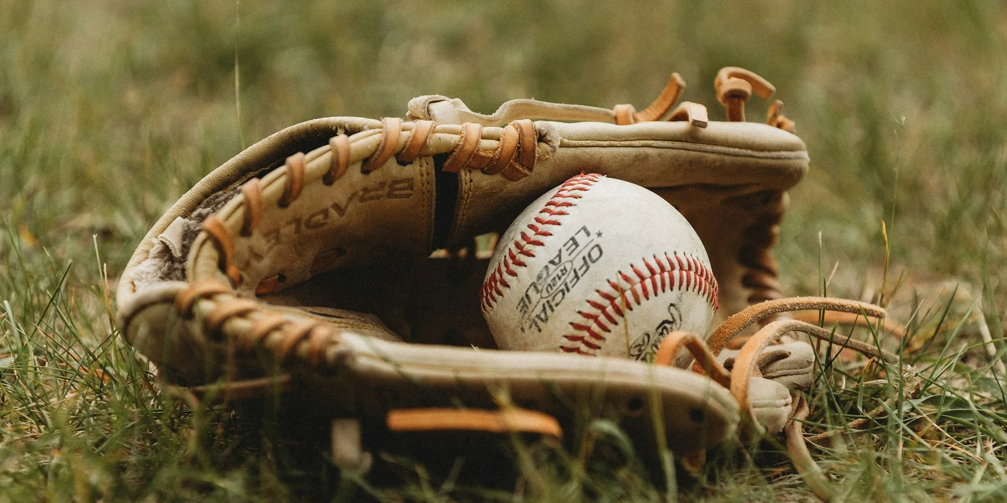 Baseball player in action wearing glove catching ball during game