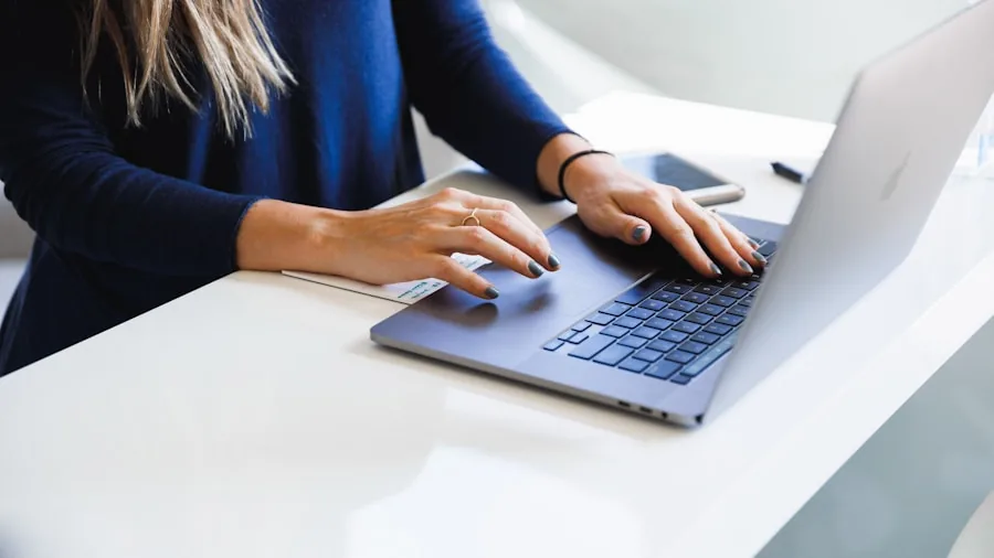 Business professional working at desk with laptop, focused on secure digital work and data protection