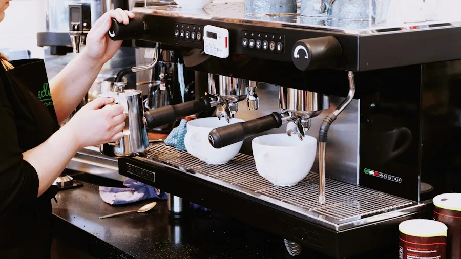 New Professional Coffee Refractometer Expands Temperature Range for Accurate Brew Measurements 2 cafe barista measuring espresso