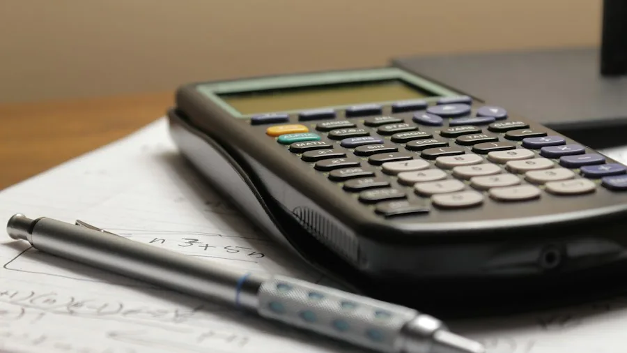 7 Tips to Decide If Buying Out Your Car Lease Makes Financial Sense 2 calculator and car purchase documents