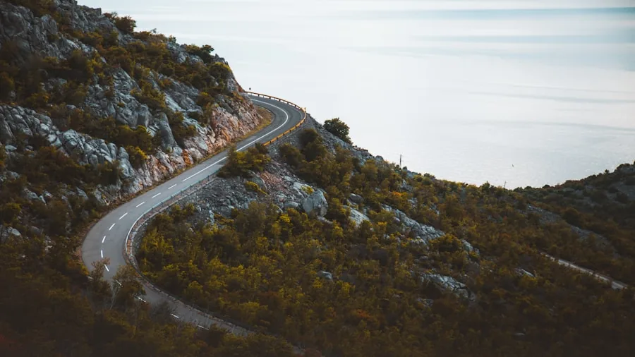 The %product_count% Best Brake Pads 5 Car descending a winding mountain road through scenic terrain during daytime driving