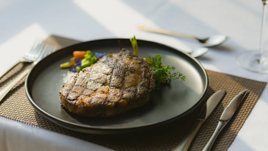 The %product_count% Best Steak Knives 6 Close-up of a plated steak dinner with knife and fork on an elegant table setting