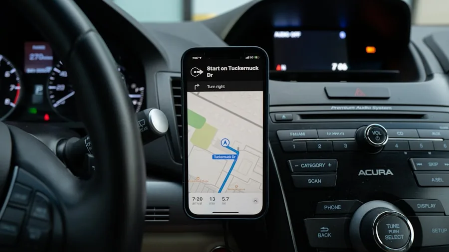 Close-up of a smartphone mounted securely on a car dashboard during daytime driving