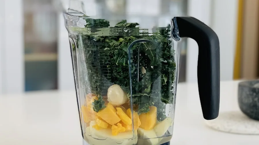 The %product_count% Best Personal Blenders 3 Close-up of blender blades mixing fresh fruit and ice into a smooth beverage