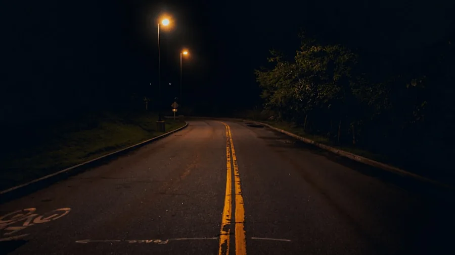The %product_count% Best Headlight Bulbs 4 Close-up of bright white headlights illuminating a dark road at night during vehicle operation