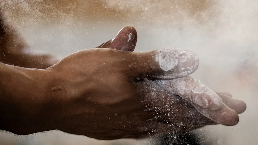 Close-up of climber's chalky hands preparing for rock climbing workout