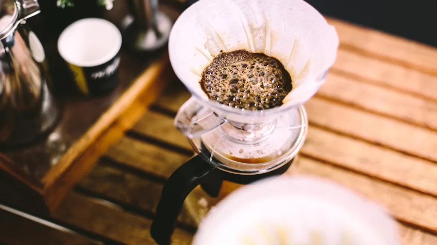 The %product_count% Best Pour Over Coffee Makers 6 Close-up of fresh roasted coffee beans being poured during pour over coffee preparation