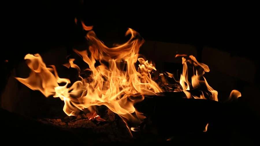 The %product_count% Best Outdoor Grills 6 Close-up of grill burners with flames showing even heat distribution across cooking surface