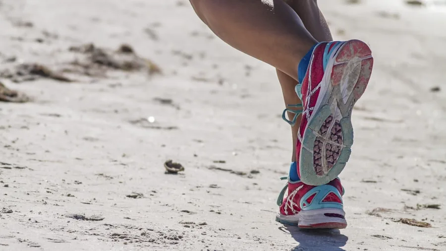 Close-up of runner inspecting sole wear on athletic shoe during outdoor run