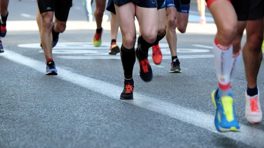 Close-up of runner's feet striking pavement during outdoor run on sunny day