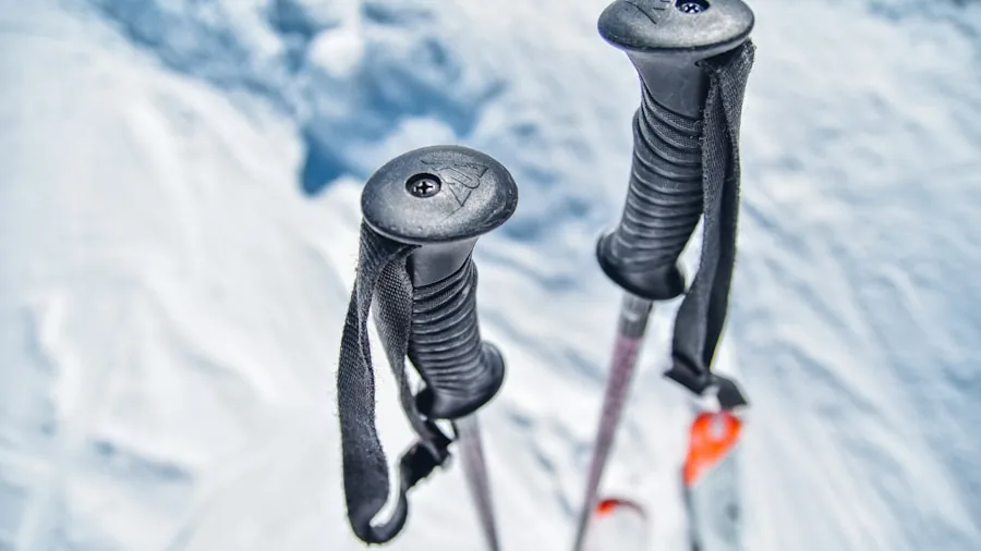 The %product_count% Best Ski Gloves 5 Close-up of skier's hands wearing durable gloves while holding ski poles on snowy slope