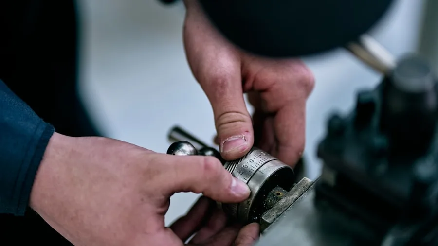Close-up of someone inspecting internal pump mechanism with focused attention to detail