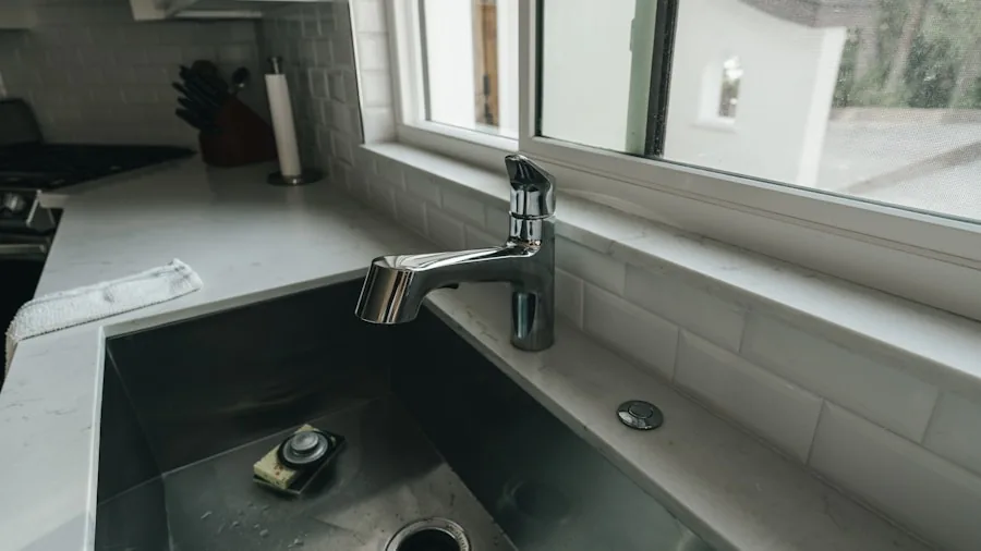 Close-up of stainless steel kitchen sink with cast iron cookware, showing material quality and everyday use