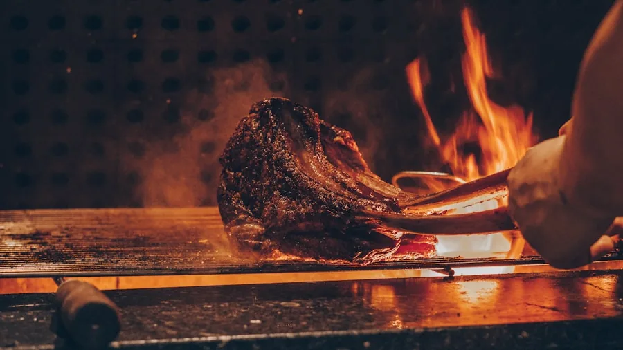 Close-up of steaks searing on hot grill grates with visible char and browning