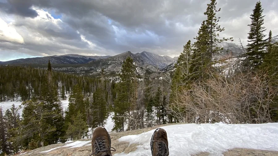 The %product_count% Best Hiking Boots for Men 4 Close-up of worn hiking boots on a rocky mountain trail during a long day hike