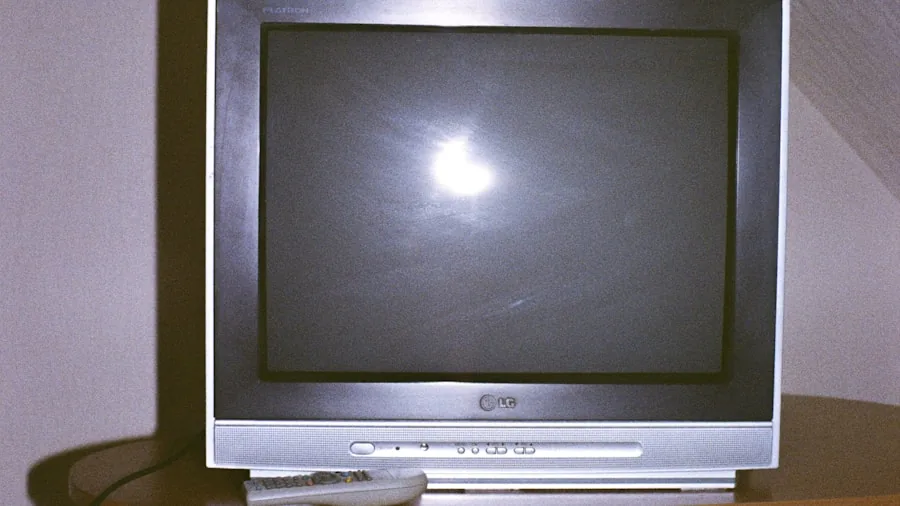 compact computer next to television display