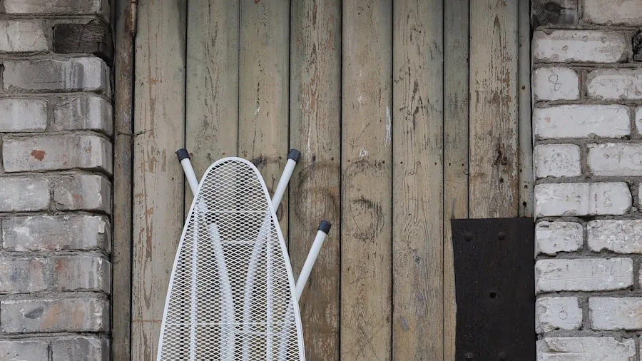 The 8 Best Ironing Boards 5 Compact ironing board hung on wall hook in organized laundry room for space-saving storage