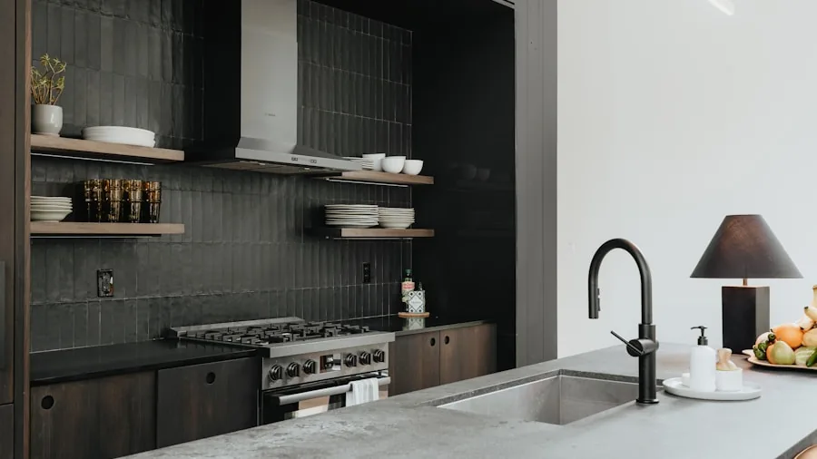 Contemporary kitchen sink with black matte faucet and stainless steel finish in modern home