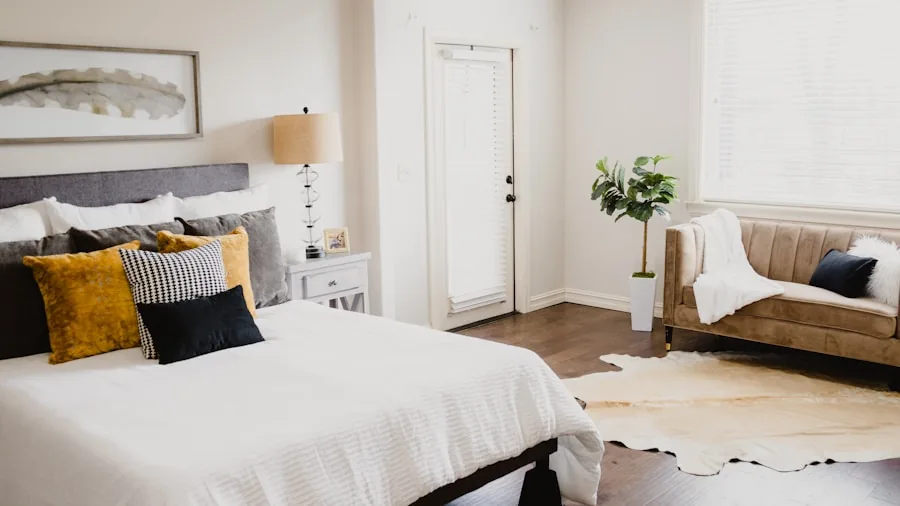 Cozy bedroom with layered bedding and natural light, showing comfortable budget-friendly bedding setup