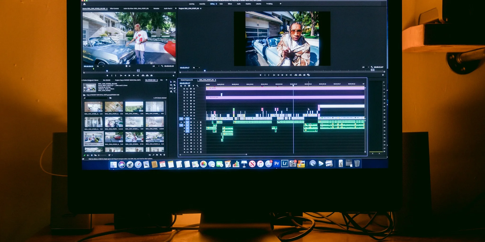 Creative professional editing video on laptop with focused concentration at desk