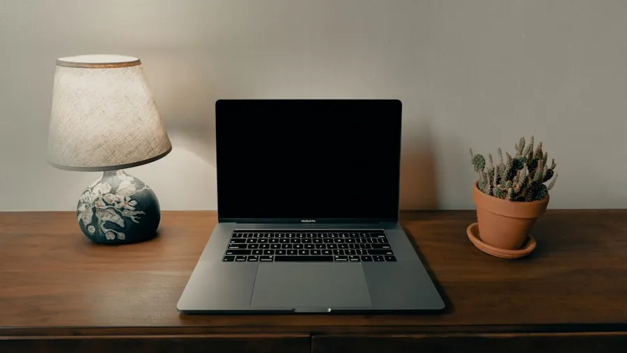 Creative professional working on laptop at portable workspace between studio and office locations