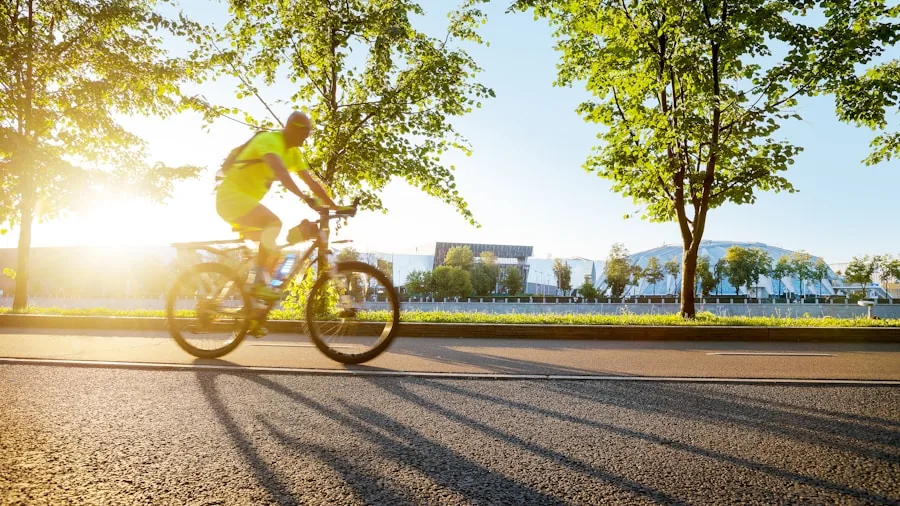Cyclist in padded shorts riding on a sunny road, demonstrating comfortable cycling posture and form