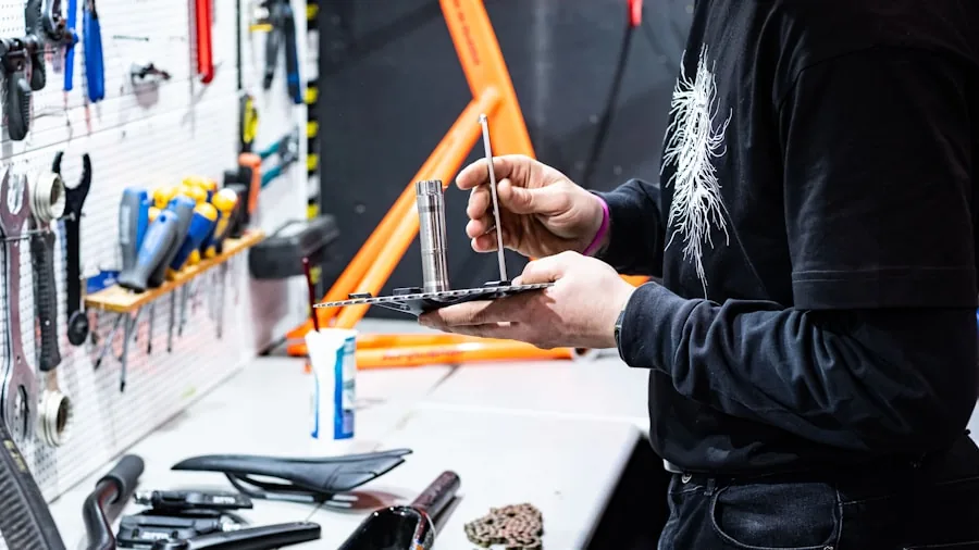 The %product_count% Best Road Bikes 2 Cyclist inspecting road bike frame outdoors in natural light