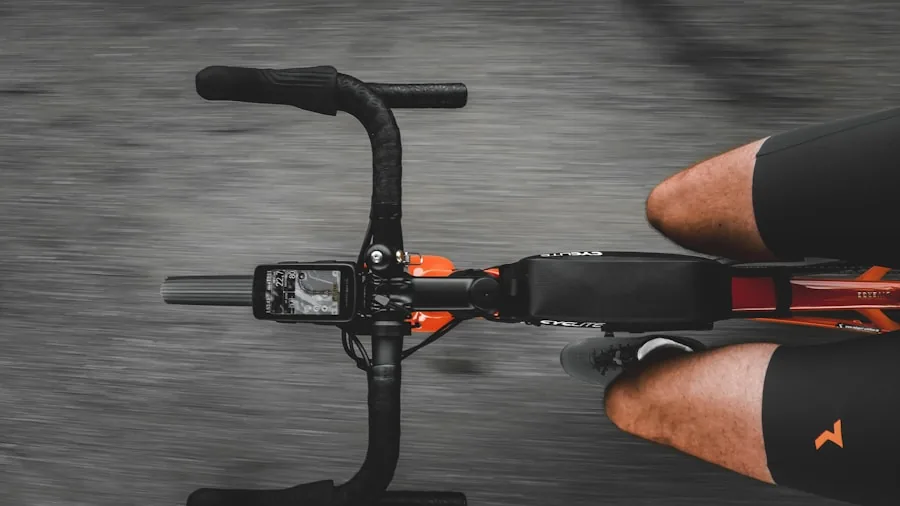 Cyclist installing and adjusting a cycling computer mount on bicycle handlebars during outdoor ride preparation