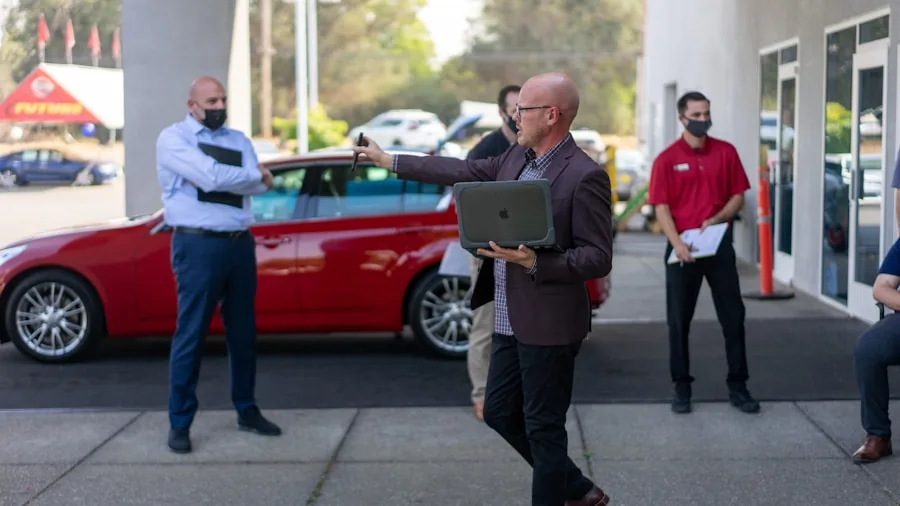 Car Leasing vs Buying: What Smart Shoppers Need to Know About Monthly Payments 3 dealership customer reviewing vehicle lease