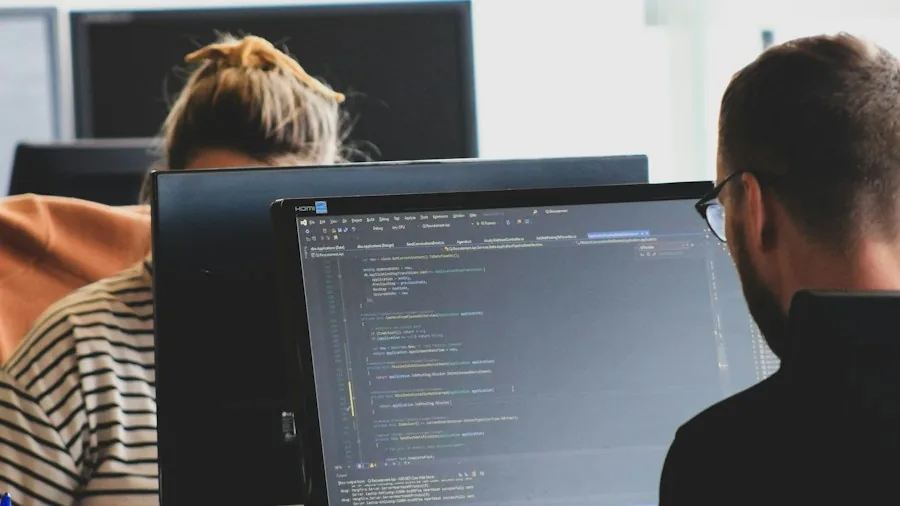 Google Simplifies Laptop and Foldable App Development: What Shoppers Should Know 2 developer working on computer code