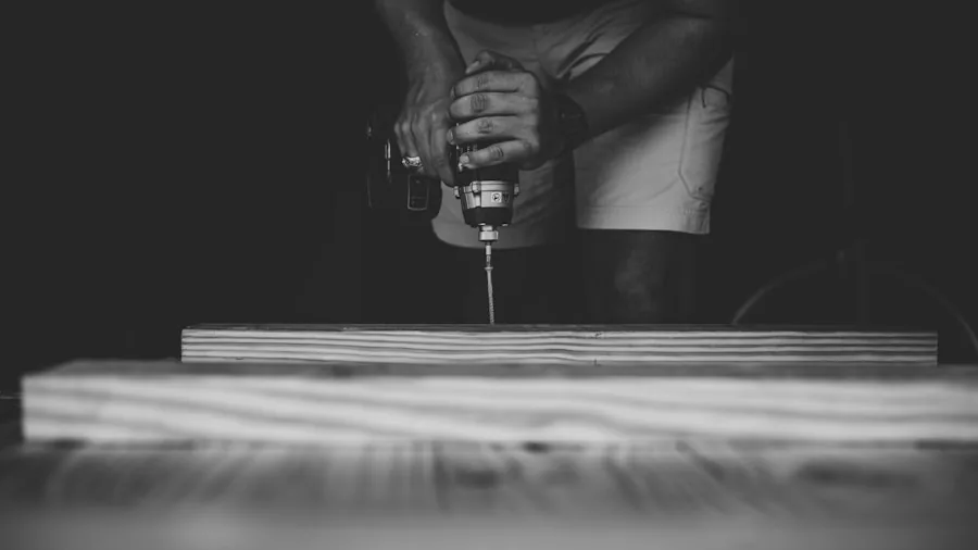 DIYer using power drill on wooden workbench in home workshop setting
