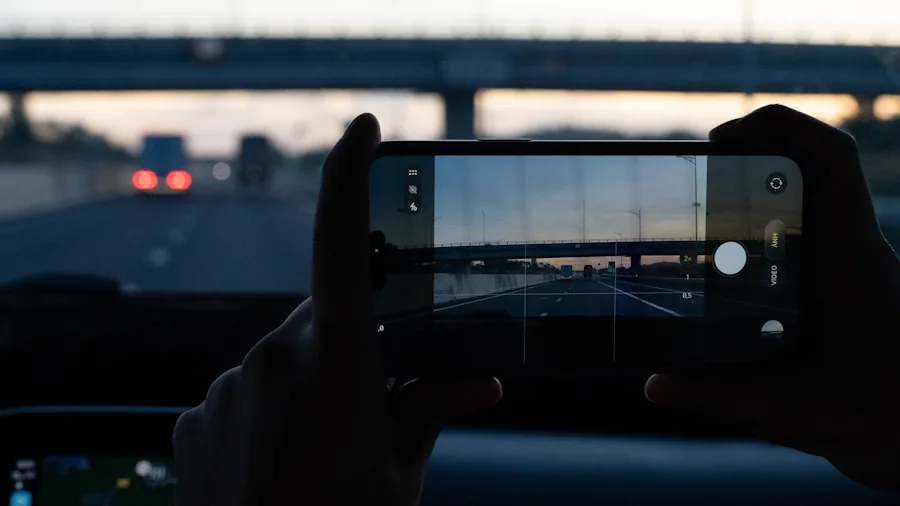 Driver checking smartphone for navigation and traffic updates while on the road