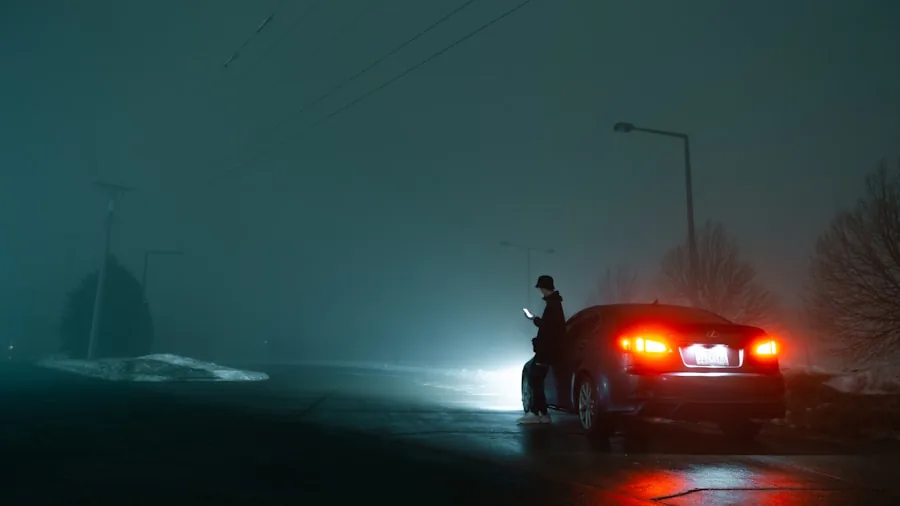 Driver reversing vehicle in low-light evening conditions with street visibility