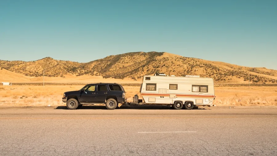 The %product_count% Best Trailer Hitches 6 Driver towing a trailer down a scenic rural highway, representing practical towing decisions and versatility