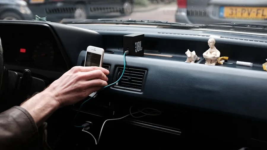 Driver tuning car speaker settings while sitting in vehicle interior