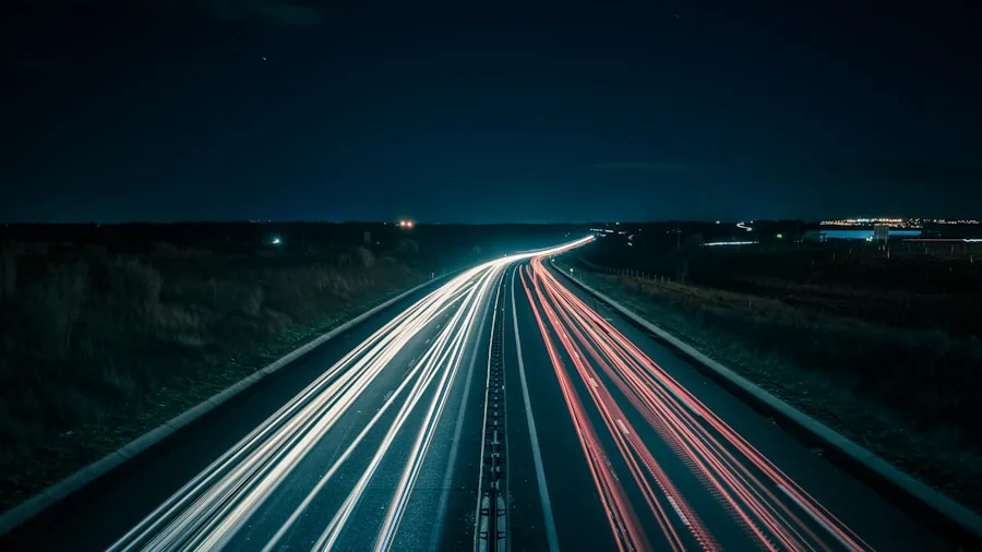 The %product_count% Best Headlight Bulbs 2 Driver's view of illuminated road ahead at night with clear beam visibility on asphalt and shoulders