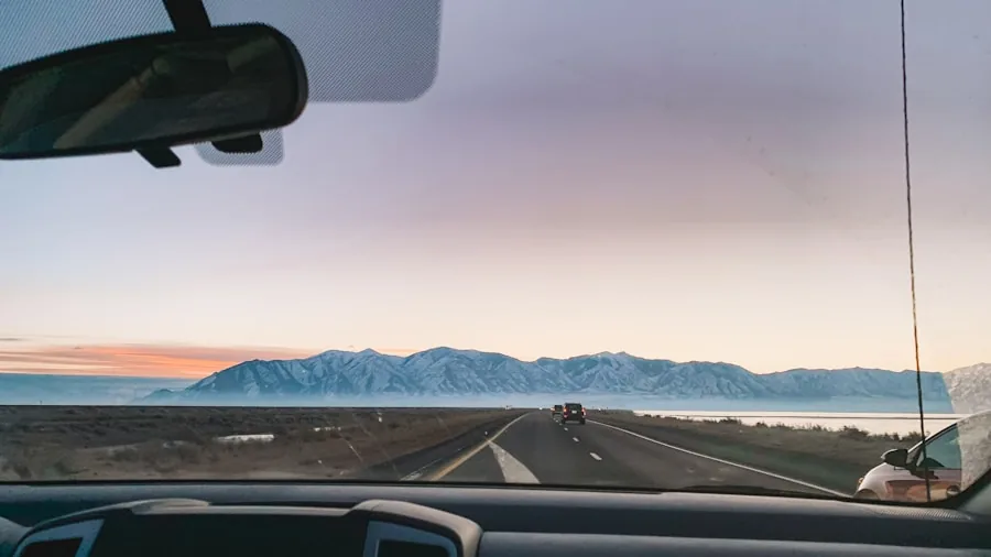 Driver's view through car windshield during daytime driving on open road