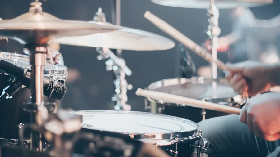 drummer performing live with drums